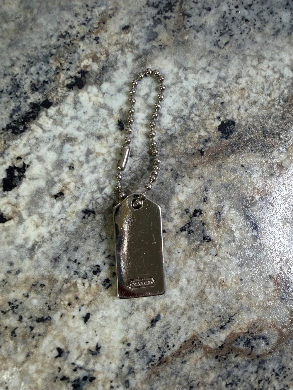 Coach Silver Tone Embossed Tag Keychain - Picture 2 of 4